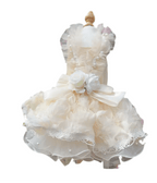 Elegant dog rosette wedding dress with lace and pearl details for stylish pet attire on special occasions.